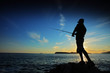 Man fishing on sunset