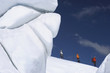 Mountain climbers hiking past ice formation