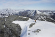 Mountain climber heading across snow for distant peak