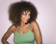 Woman with Curly Hair winking in studio, half-length