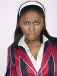 Woman frowning in studio, head and shoulders