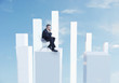 Business man sitting in chair on white pillar, digital composite