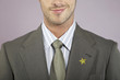 Businessman with gold star on suit, portrait