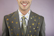 Businessman with gold stars on suit, portrait