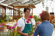 woman buying orchids