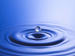 Drop hitting surface of water, close-up