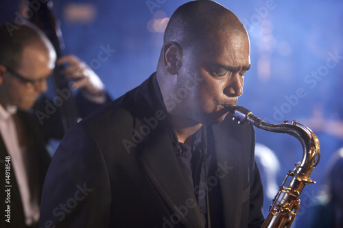 Photo: Saxophone player on stage, portrait Saxophone player on stage, portrait