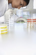 Female lab worker with petri dishes