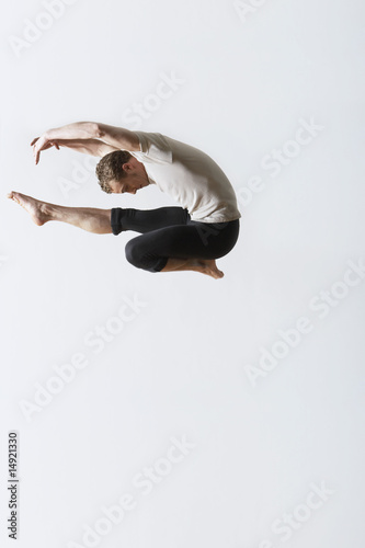 Photo: Ballet dancer leaping in mid-air Ballet dancer leaping in mid-air