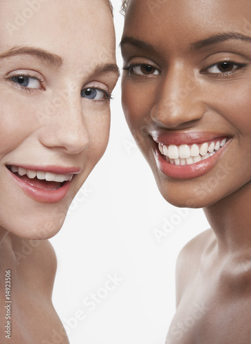 Photo: Two beautiful young women, smiling Two beautiful young women, smiling