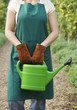 Woman Holding Watering Can
