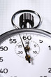 Stopwatch on graph paper, cropped