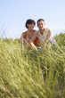 Couple Relaxing on Dunes