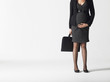 Pregnant businesswoman, low section