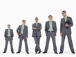 Row of businessmen in ascending order of height