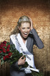 Photo: Woman screaming, wearing Employee of the Month pageant paraphernalia, against gold velvet background Woman screaming, wearing Employee of the Month pageant paraphernalia, against gold velvet background