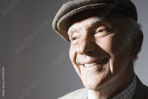 Photo: Senior man in flat cap, close up, in studio Senior man in flat cap, close up, in studio