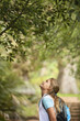 Girl Looking Up at Tree