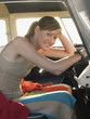 Young Woman at Wheel of Camper Van