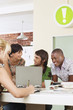 Foto: Four people having meeting around laptop. Four people having meeting around laptop.