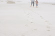 Father and Son Strolling on Beach