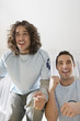Two Excited Fans Watching Television