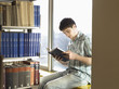 College Student Reading in Library