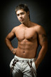 Studio portrait of shirtless sexy muscular man