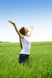 Young woman on green meadow
