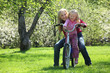 girl with mother sit on bicycle in blossoming spring garden girl with mother sit on bicycle in blossoming spring garden