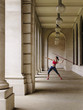 Female athlete throwing javelin in portico