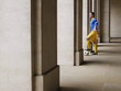 Foto: Soccer player holding foot on ball, standing in portico Soccer player holding foot on ball, standing in portico