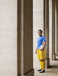 Foto: Soccer player holding ball, standing in portico, portrait Soccer player holding ball, standing in portico, portrait