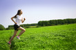 beautiful girl runs on grass