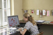 Woman using computer in office