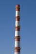 Factory pipe on a blue sky.