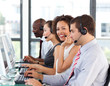 Smiling businesswoman working in a call center Smiling businesswoman working in a call center