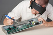 Engineer repairing circuit board