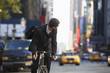Man riding bicycle on street