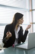 Professional woman with nail polish at desk with laptop