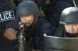 Swat officers with gun and shield