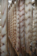 fish fillets hanging to dry