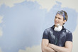 Man looking at half-painted wall