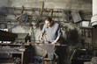 Blacksmith Working in Shop