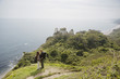 Couple Standing on an Outlook Above the Water