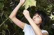 Woman Examining Leaf