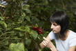 Woman Examining Leaf
