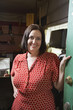 second hand store owner standing in doorway