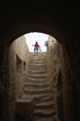woman climbing stairs in the tombs of the kings paphos cyprus