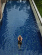 Young Woman in Bikini by Swimming Pool
